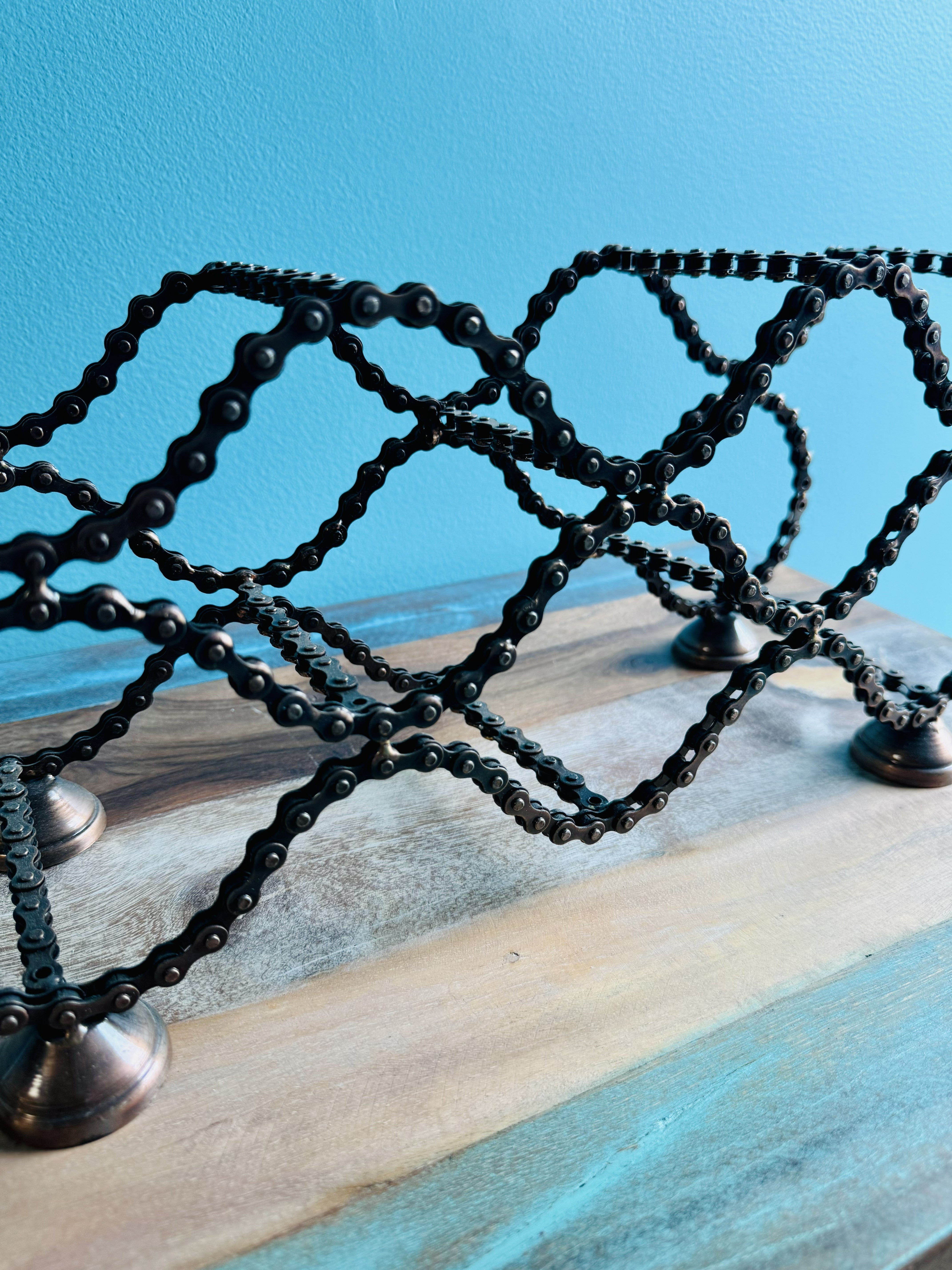 Bicycle Chain wine rack angled view showing layered bike chain slots