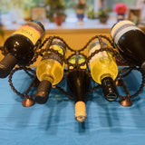 Bicycle Chain wine rack holding wine bottles