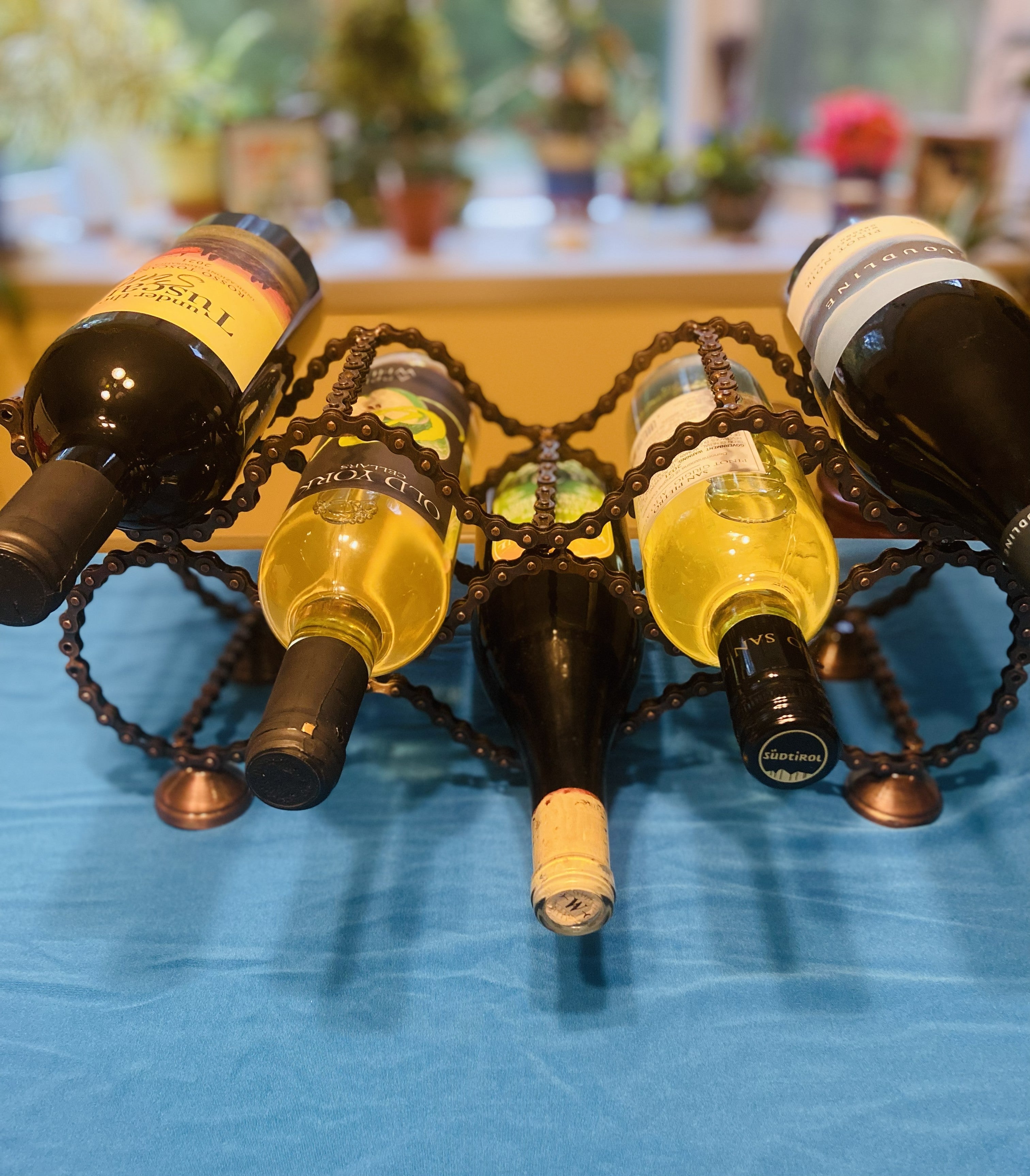 Bicycle Chain wine rack holding wine bottles